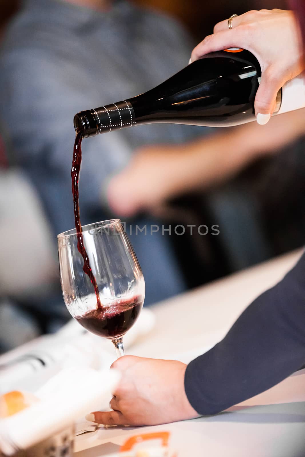 Pouring Red wine into Glass in Portuguese restaurant