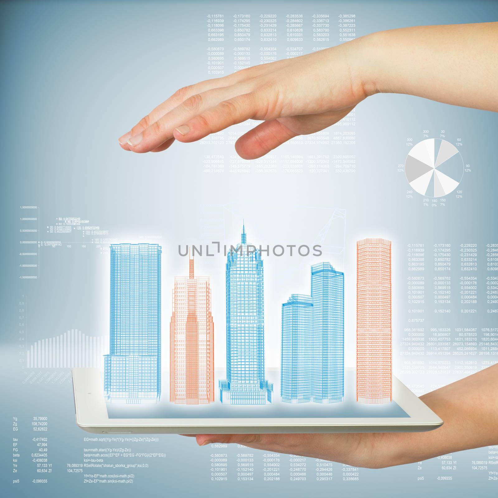 Hands holding a tablet computer. In screen tablet city of skyscrapers