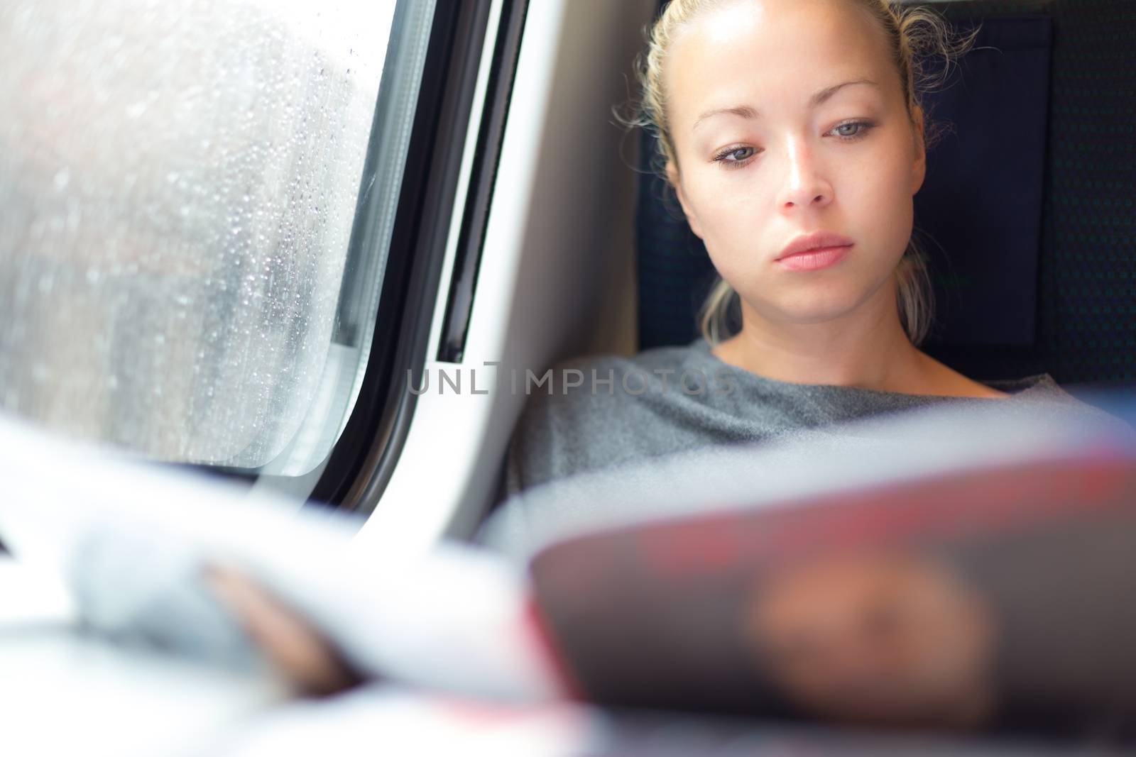 Lady traveling by train. by kasto