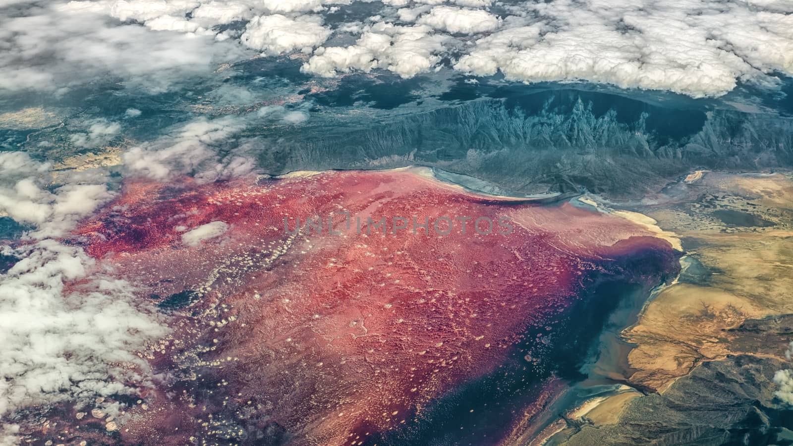 Aerial view of Lake Natron, found near Mount Kilimanjaro in Tanzania, with bright red color attributed to salt loving halophile organisms