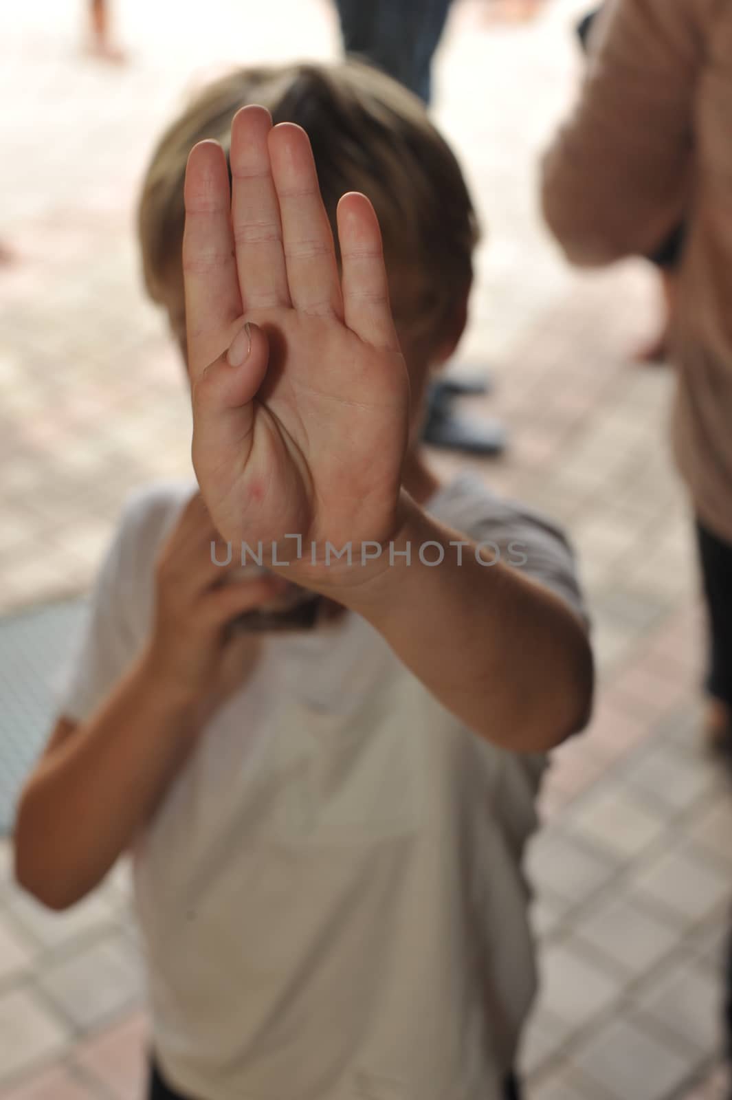 Boy Saying Stop With His Hand by seawaters