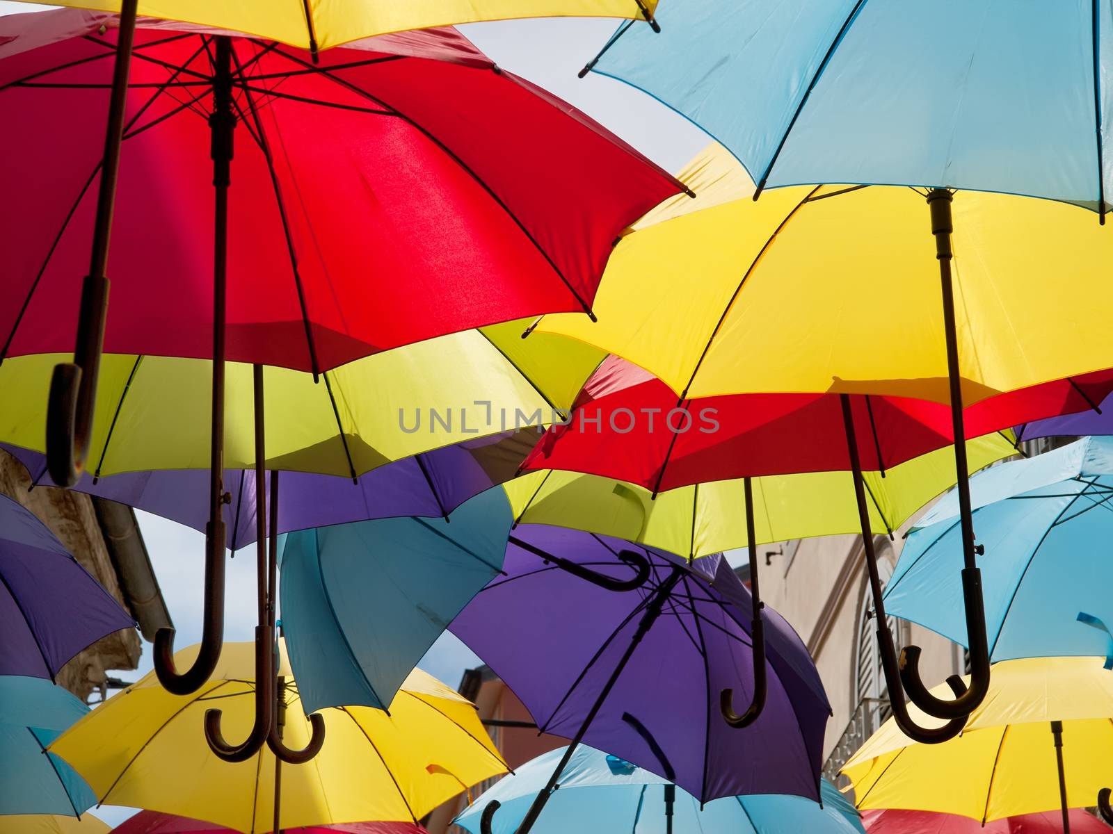 a lot of open multicolored umbrellas, street decoration 