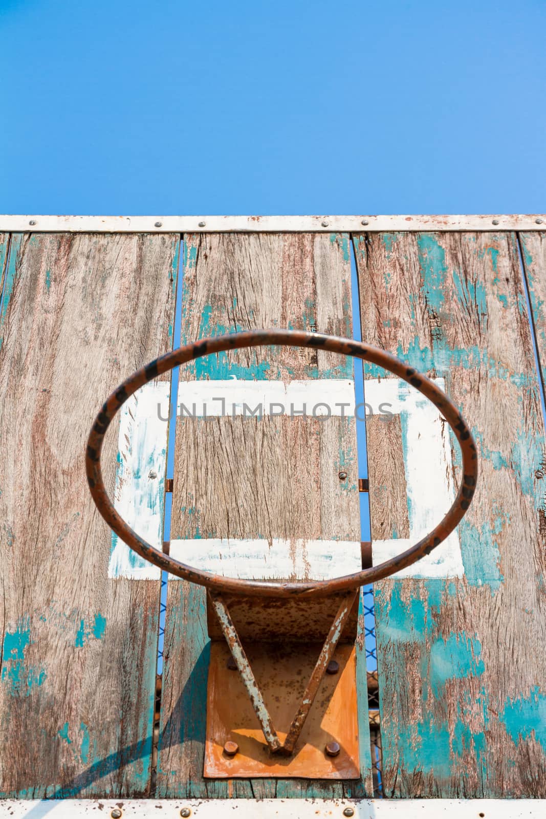Closeup low angle view of old basketball board without net on hoop