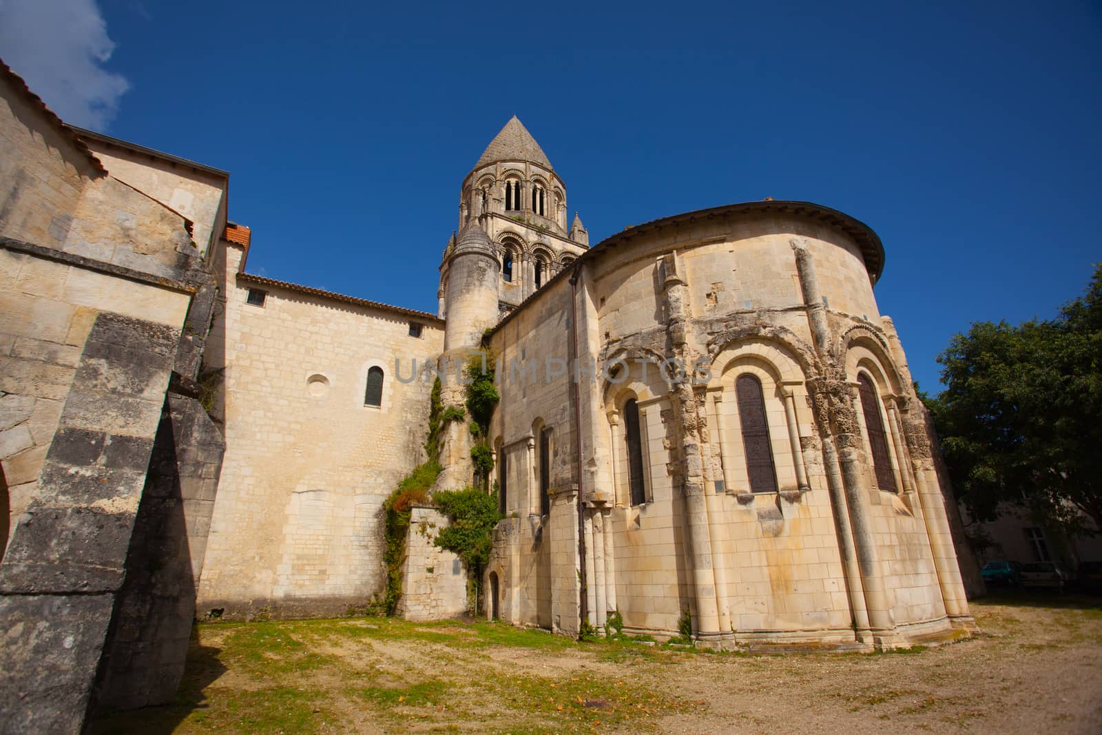 General view with abse and tower of the romanesque chruch of Abbaye aux Dames in Saintes France