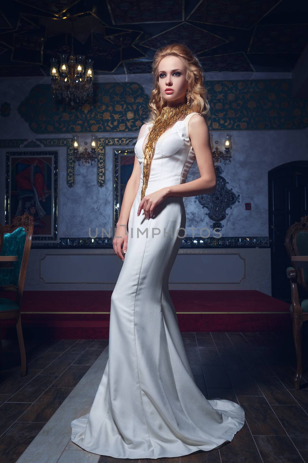 Fashion photo of young magnificent woman in white dress