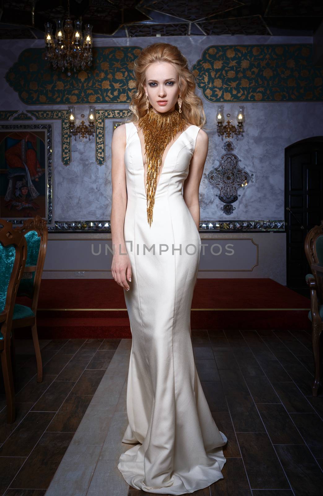 Fashion photo of young magnificent woman in white dress