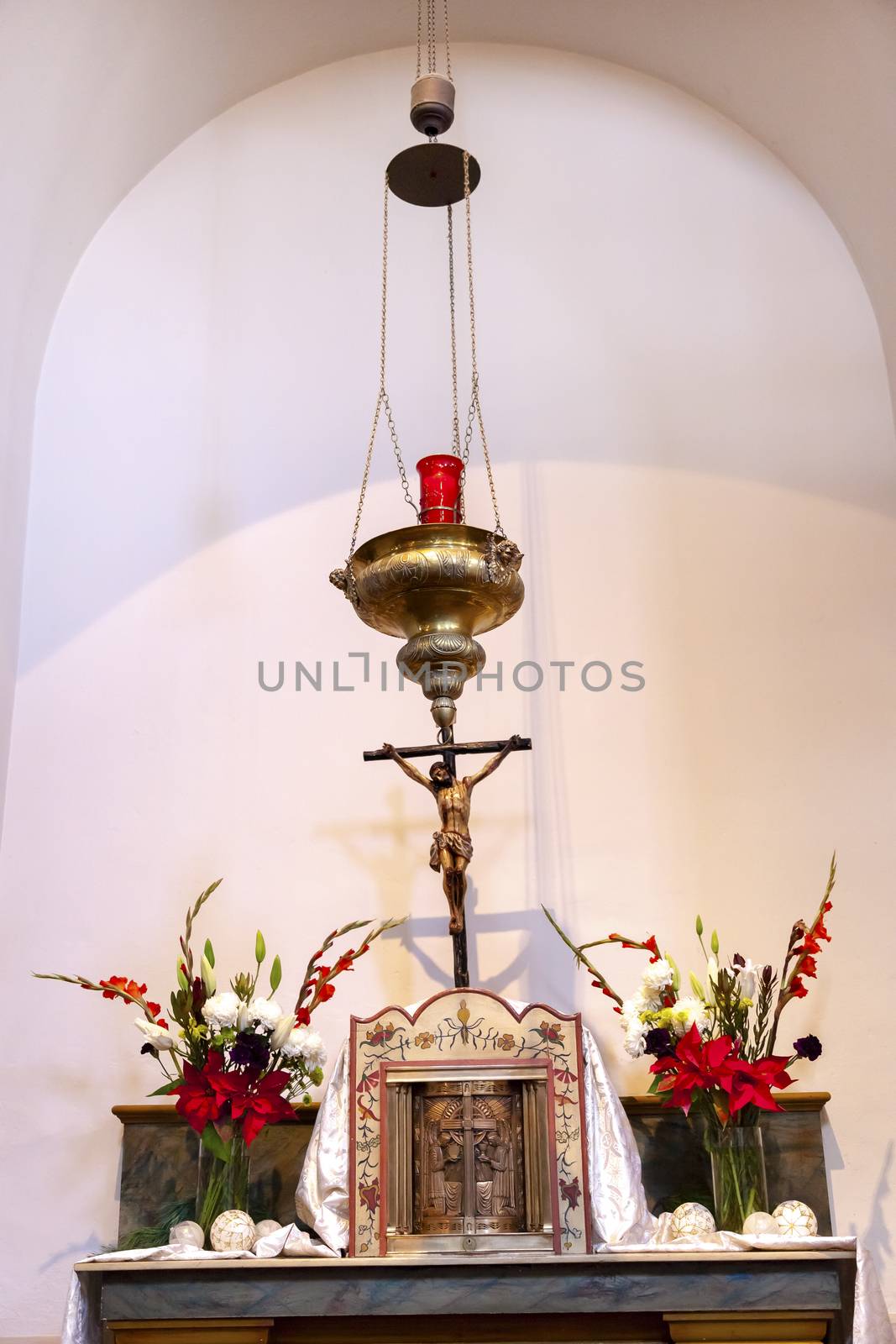 Incense holder cross altar basiilica Mission San Luis Obispo de Tolosa, San Luis Obispo California.  Founded 1772 by  Father Junipero Serra.  Named for Saint Louis of Anjou