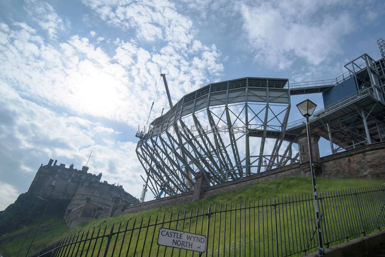 EDINBURGH, SCOTLAND - MAY 31, 2014: Edinburgh Castle on Castle Rock in Edinburgh, Scotland, UK is getting ready for its famous military tattoo festival with tribunes being mounted along the entrance walls on May 31, 2014 in Edinburg, Scotland, United Kingdom.