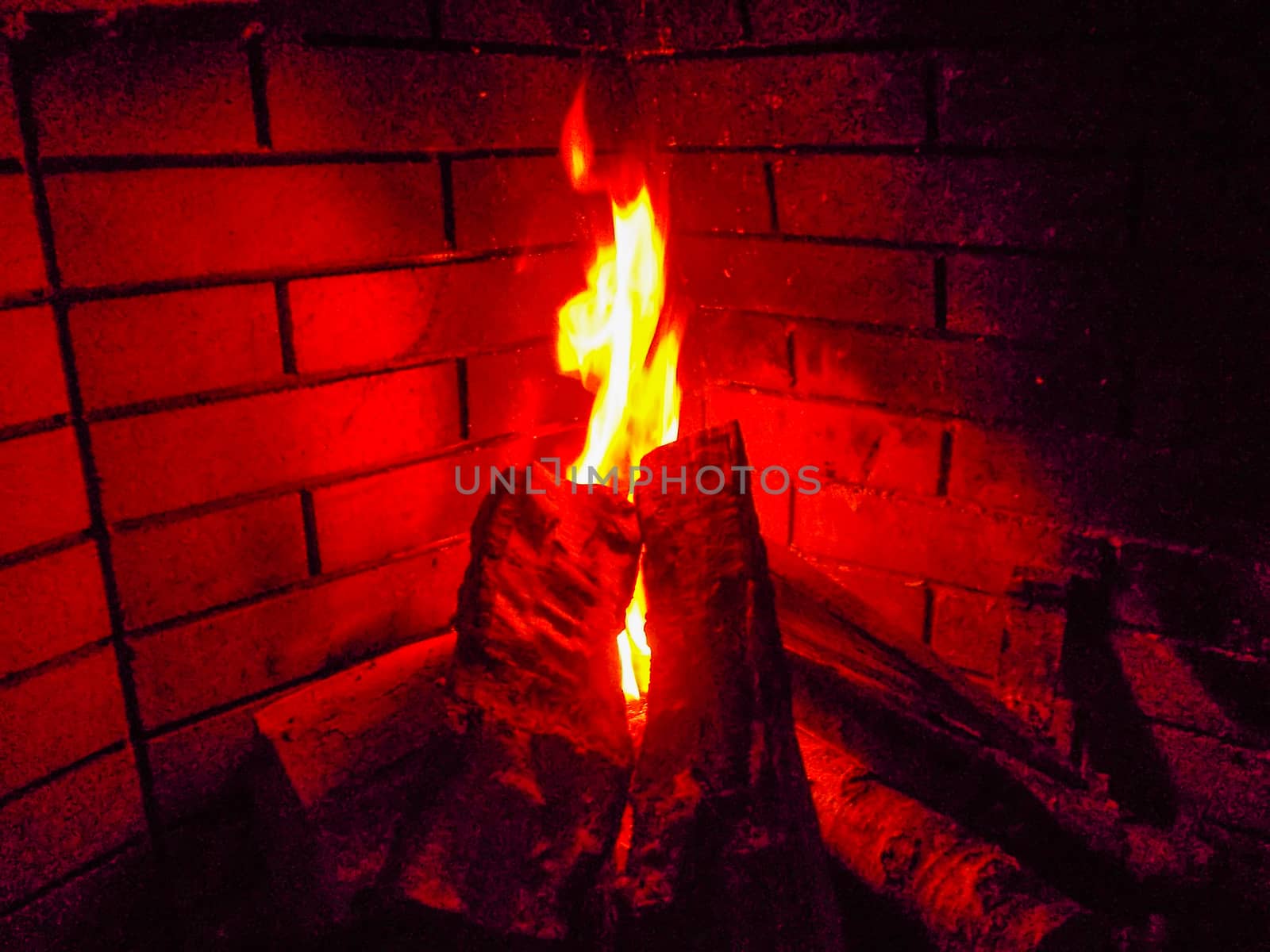 Fire in a fireplace with wood