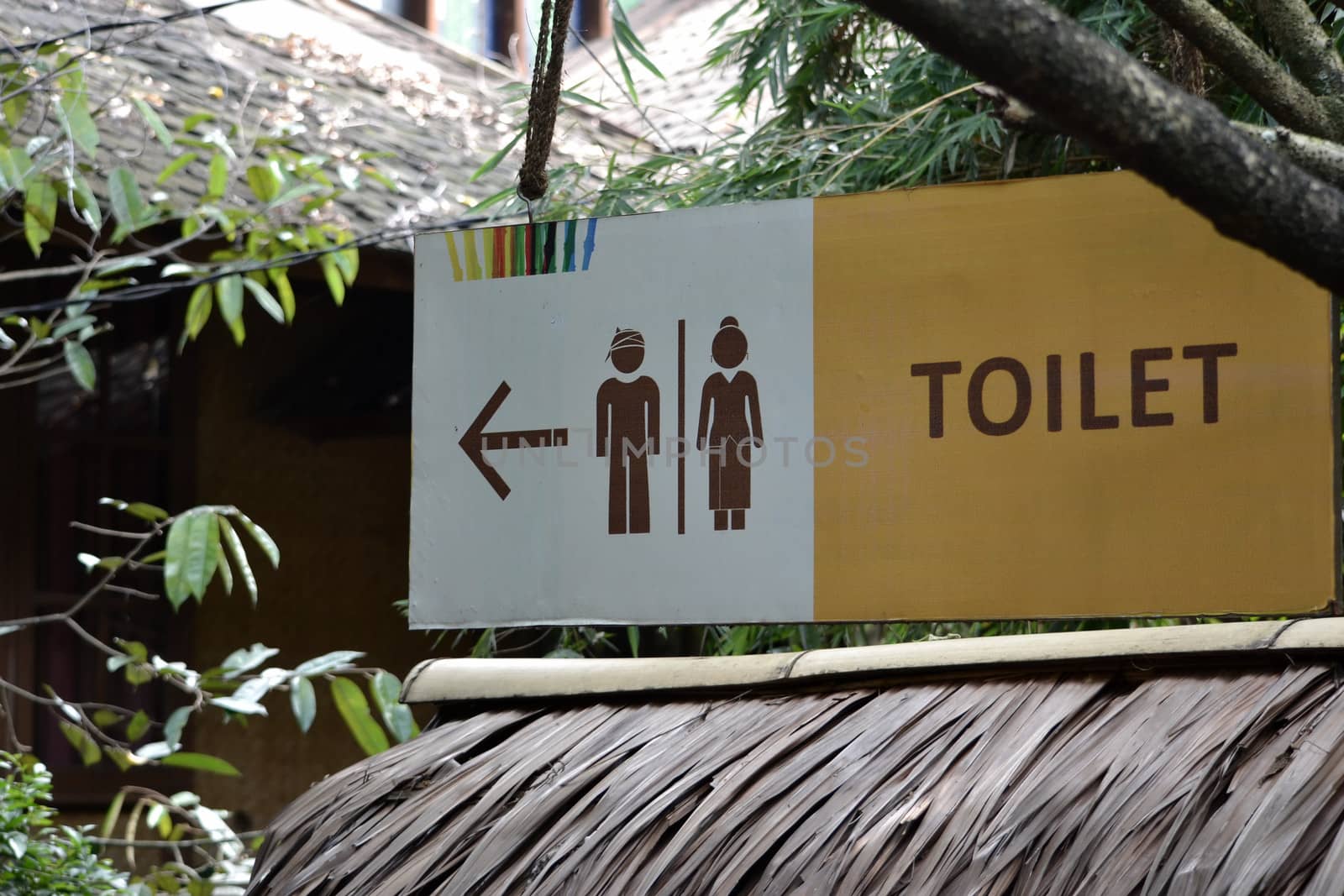 bandung, indonesia-june 16, 2014: saung angklung udjo toilet sign displayed in front of main entrance gate.