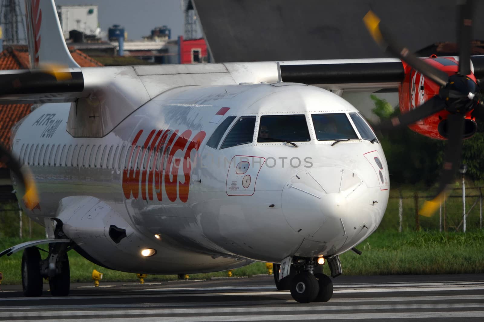 bandung, indonesia-june 16, 2014: Wings Air airplane taking manoeuvre on husein sastranegara airport bandung.