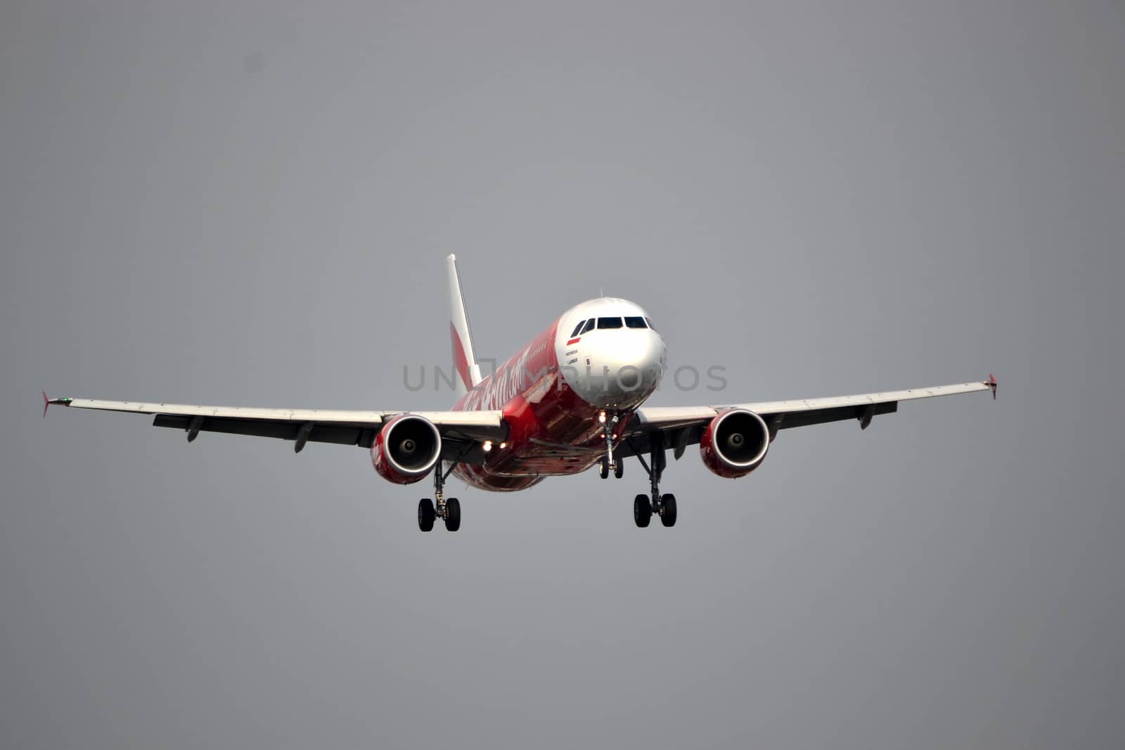 bandung, indonesia-june 16, 2014: Air Asia airplane taking manoeuvre on husein sastranegara airport bandung.