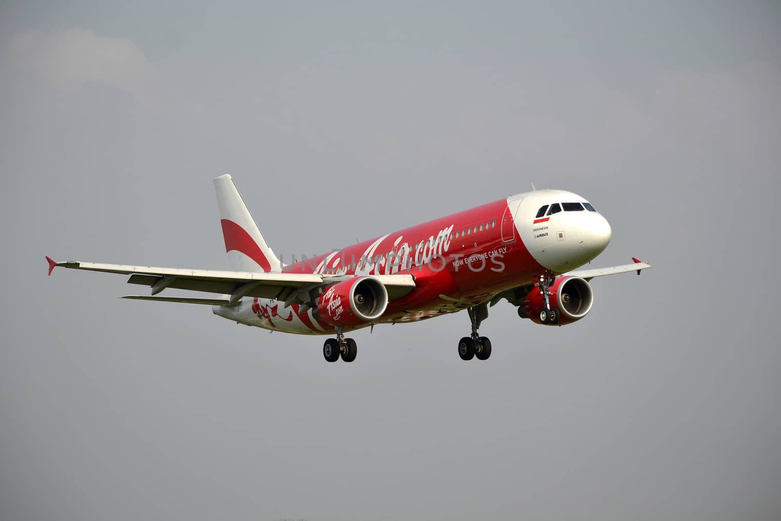 bandung, indonesia-june 16, 2014: Air Asia airplane taking manoeuvre on husein sastranegara airport bandung.