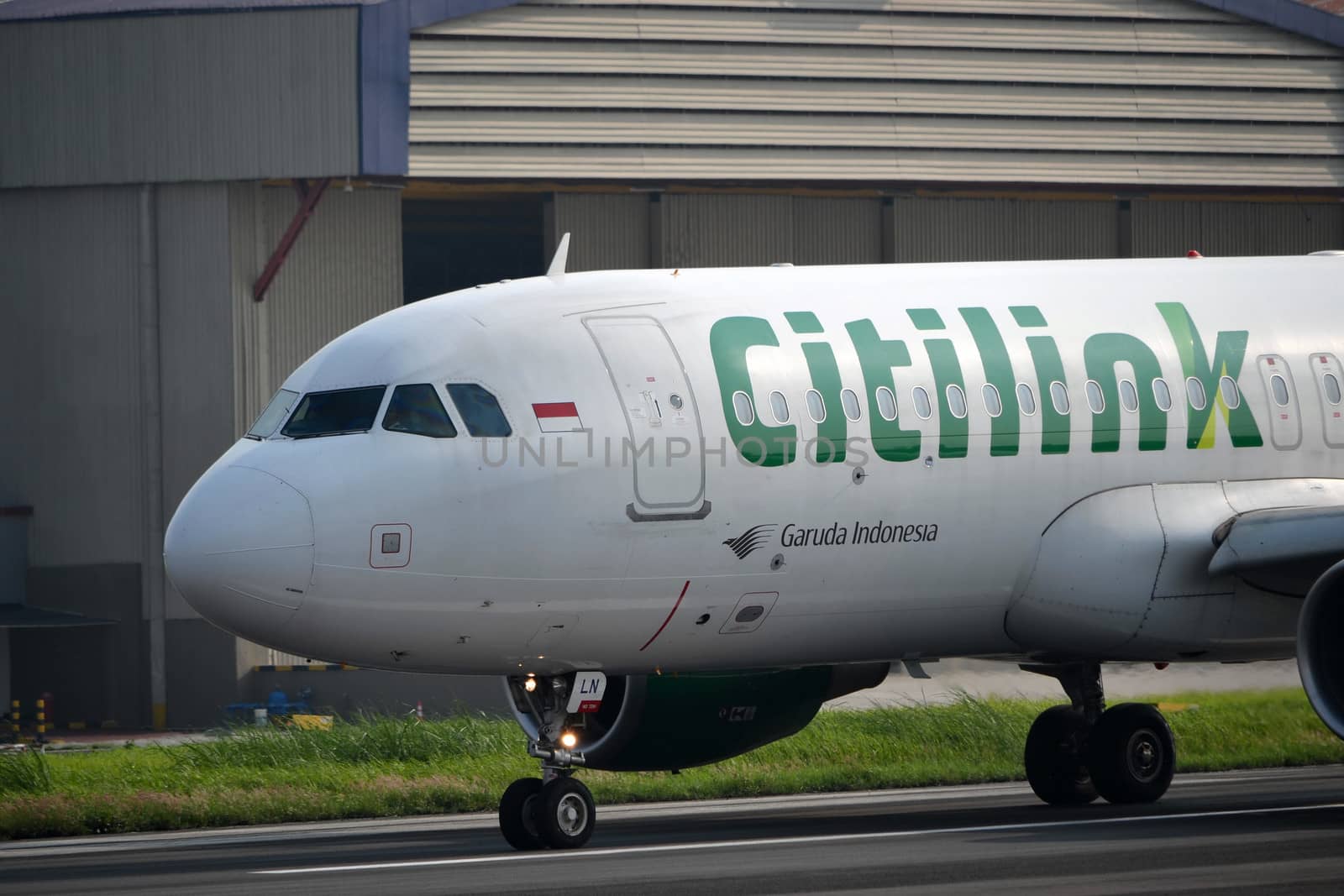 bandung, indonesia-june 16, 2014: Citilink airplane taking manoeuvre on husein sastranegara airport bandung.
