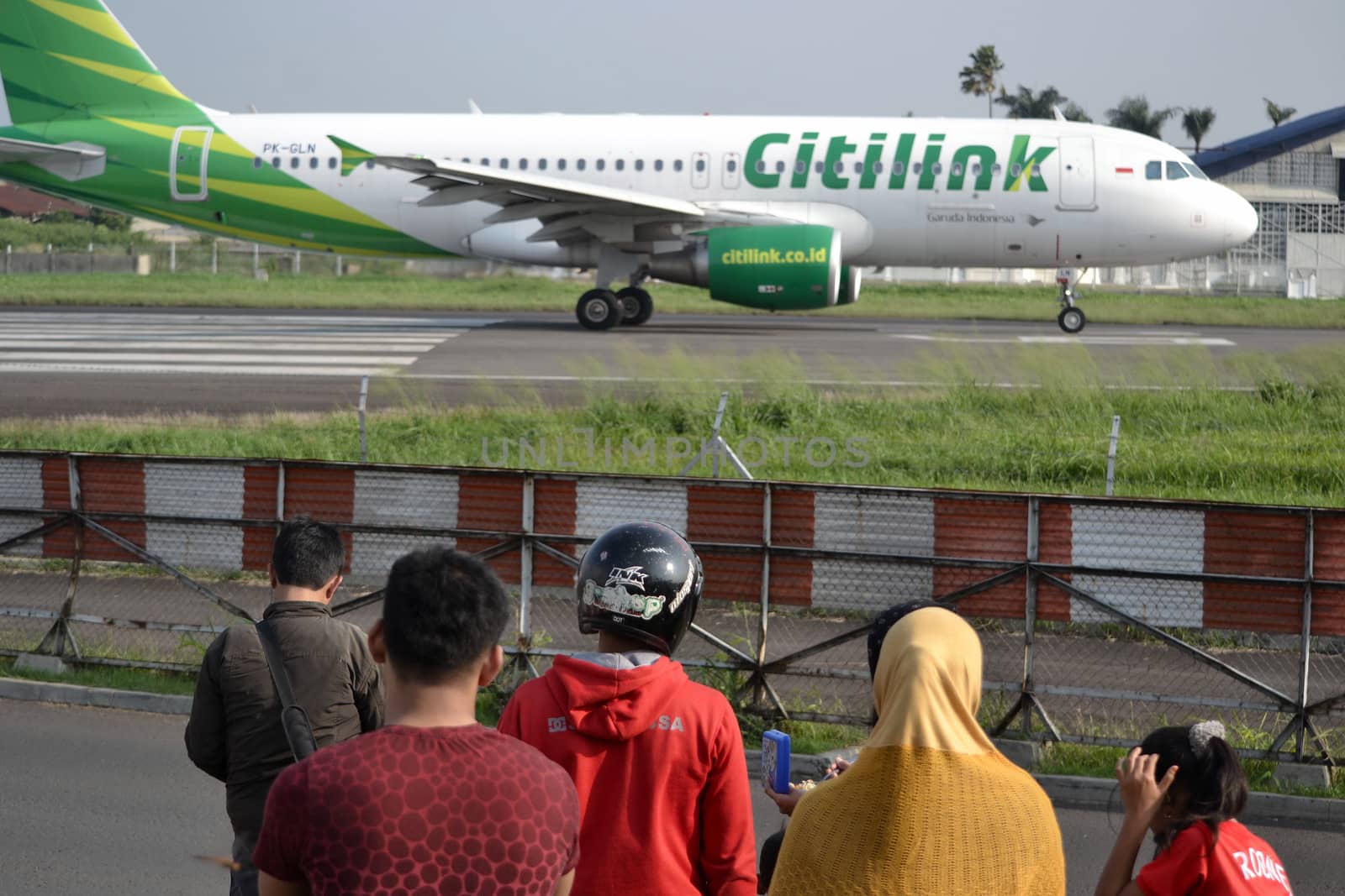bandung, indonesia-june 16, 2014: Citilink airplane taking manoeuvre on husein sastranegara airport bandung.