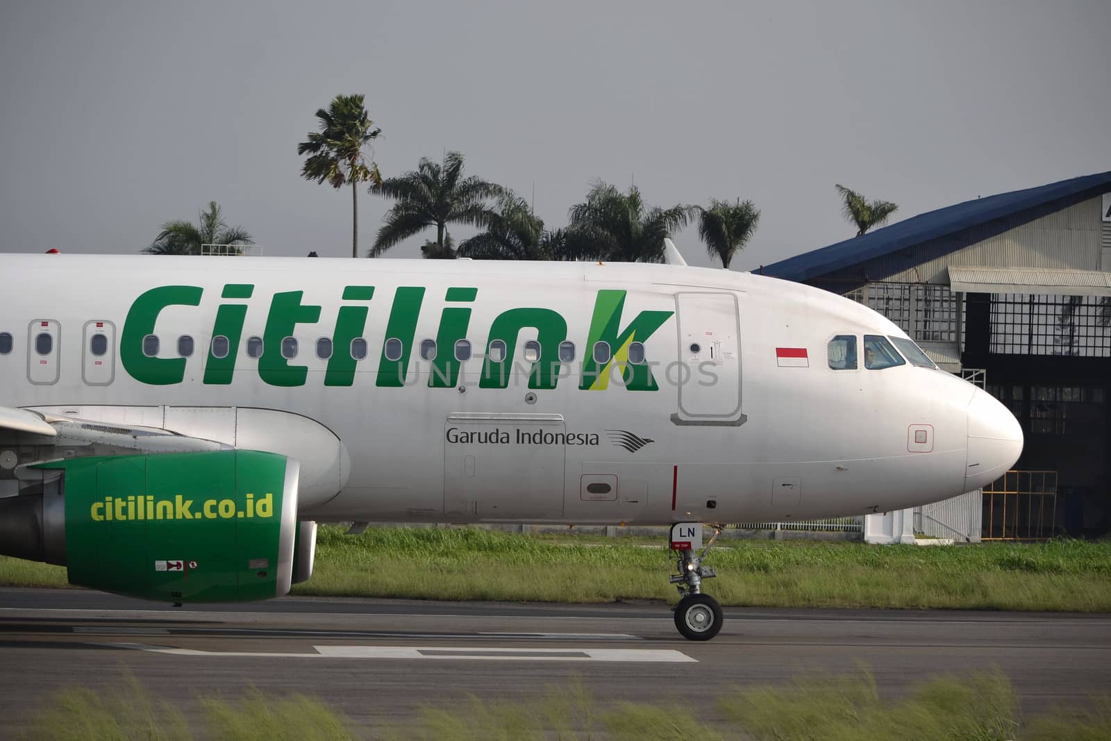 bandung, indonesia-june 16, 2014: Citilink airplane taking manoeuvre on husein sastranegara airport bandung.