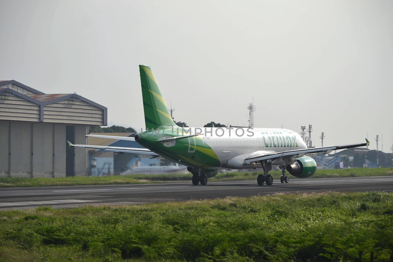 bandung, indonesia-june 16, 2014: Citilink airplane taking manoeuvre on husein sastranegara airport bandung.