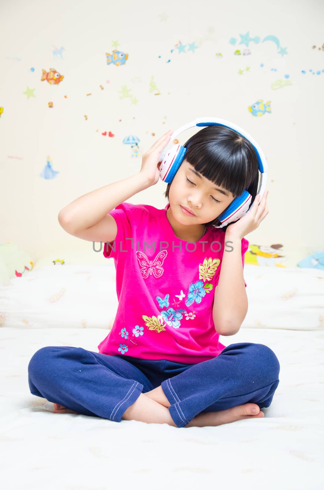 Girl listening the music by earphone.