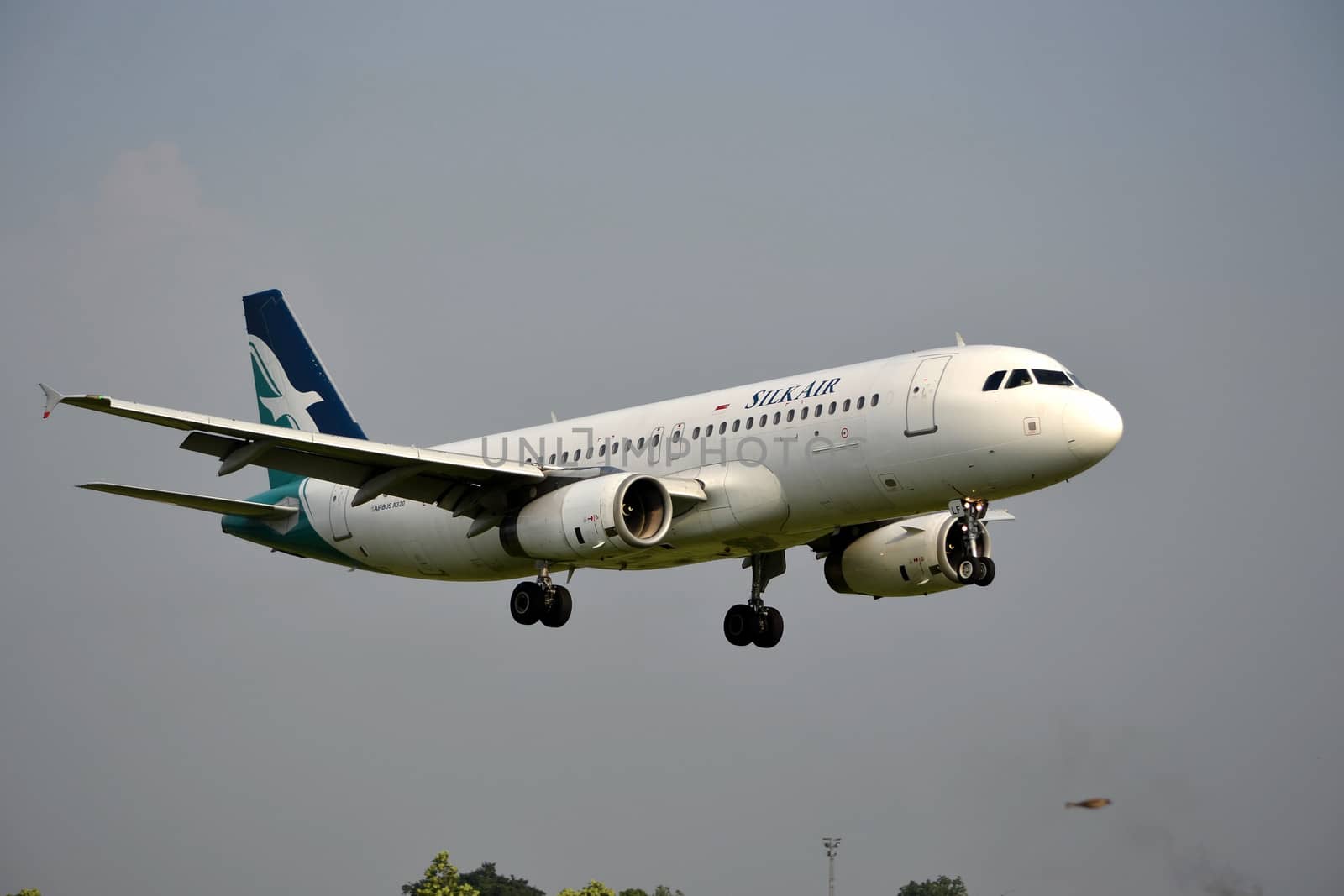 bandung, indonesia-june 16, 2014: Silk Air airplane taking manoeuvre on husein sastranegara airport bandung.