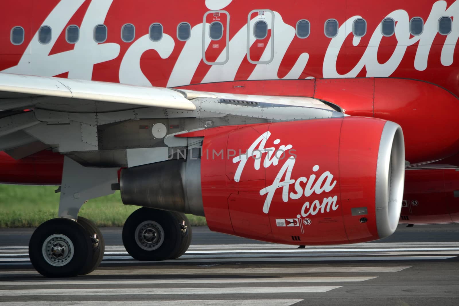 bandung, indonesia-june 16, 2014: Air Asia airplane taking manoeuvre on husein sastranegara airport bandung.