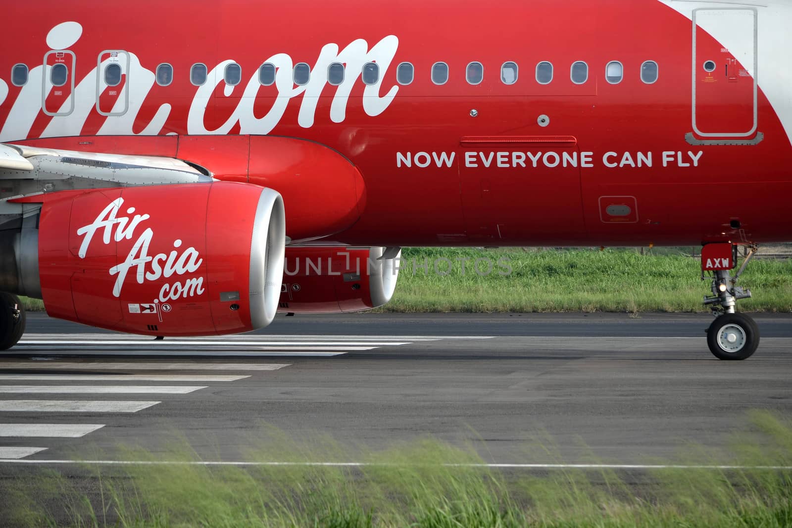 bandung, indonesia-june 16, 2014: Air Asia airplane taking manoeuvre on husein sastranegara airport bandung.