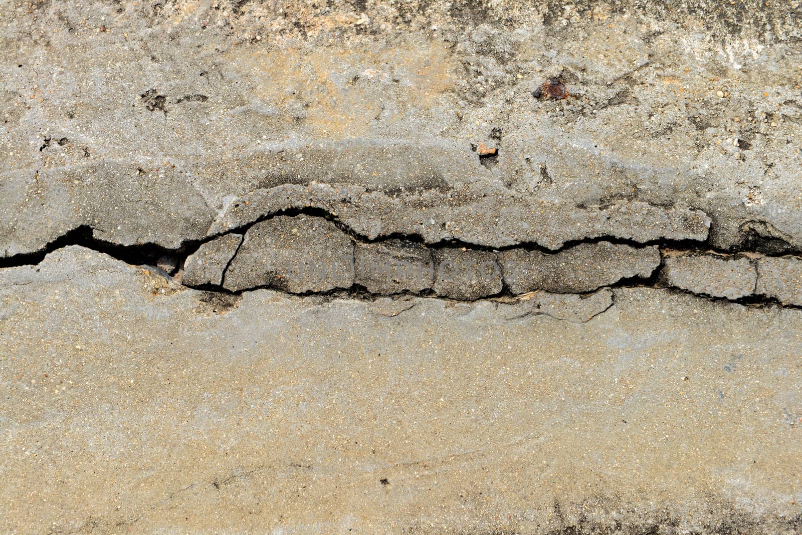 Composition of cracked concrete texture closeup background. 