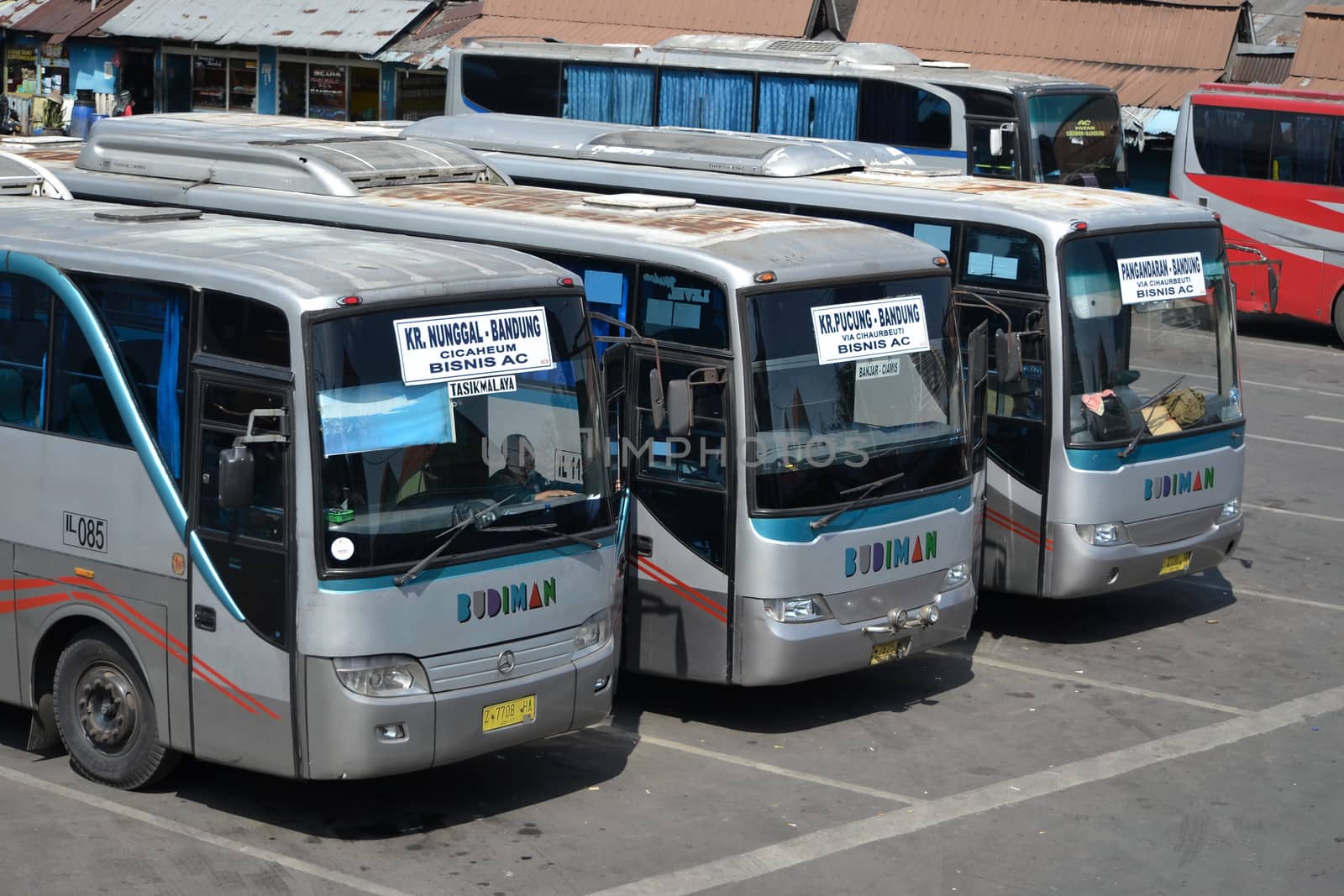 bandung, indonesia-june 16, 2014: bus parking at cicaheum bus station waiting for passenger to board.