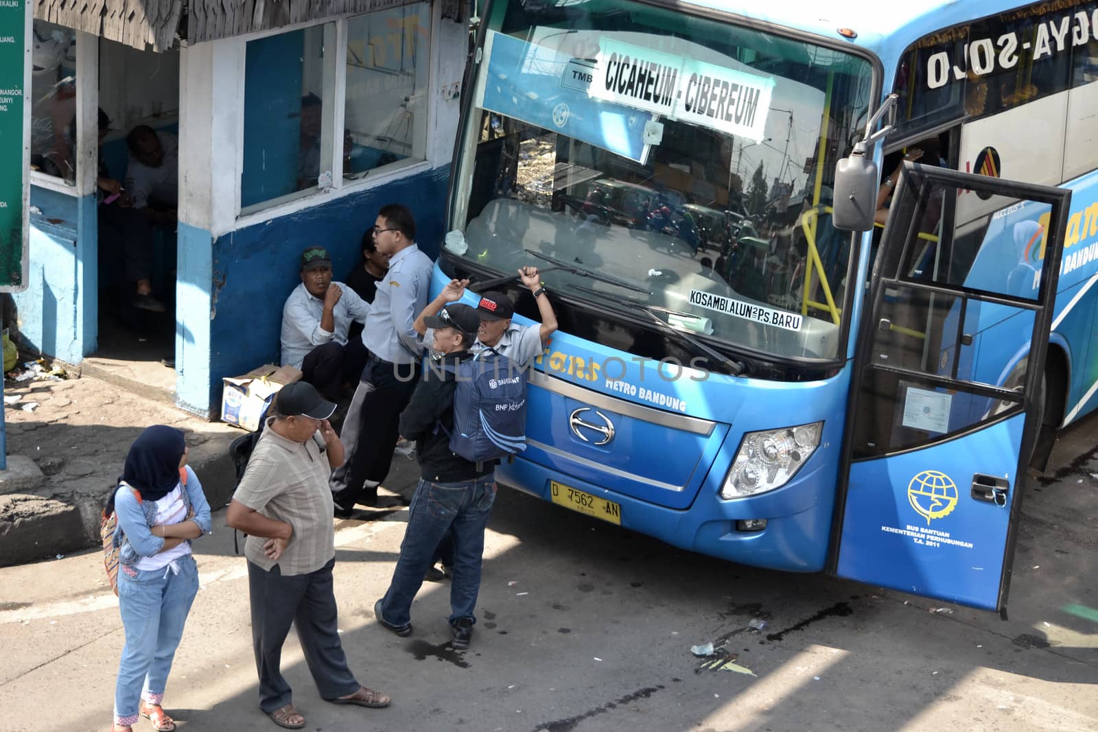bandung, indonesia-june 16, 2014: bus parking at cicaheum bus station waiting for passenger to board.
