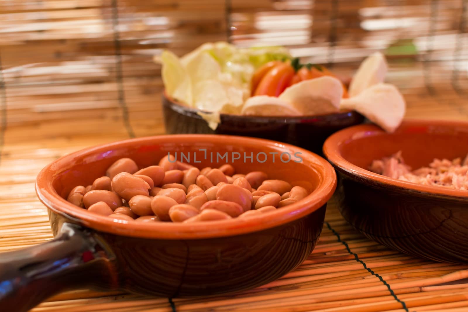 Set of three bowls with salad, beans and tuna by enrico.lapponi