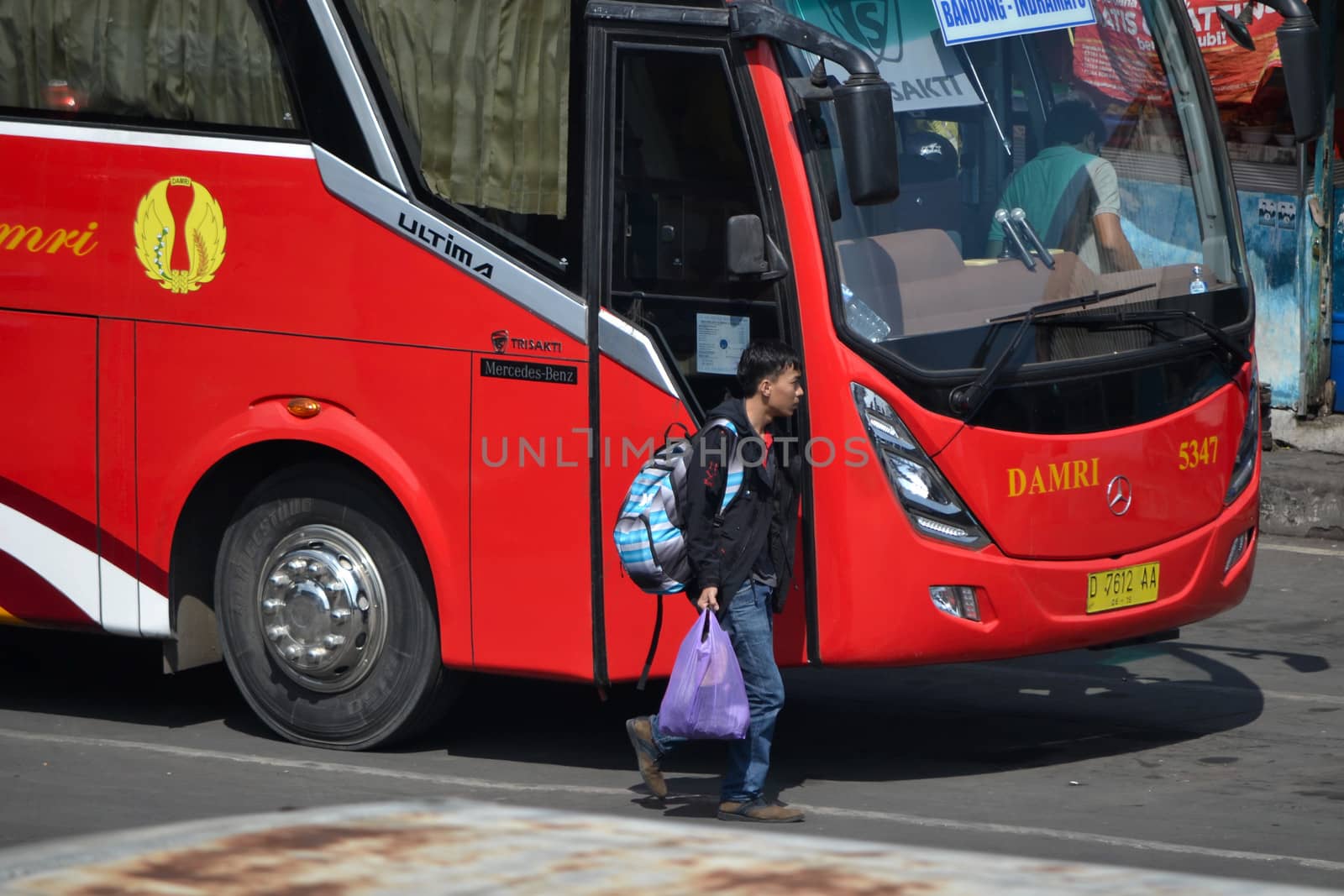 bandung, indonesia-june 16, 2014: bus parking at cicaheum bus station waiting for passenger to board.