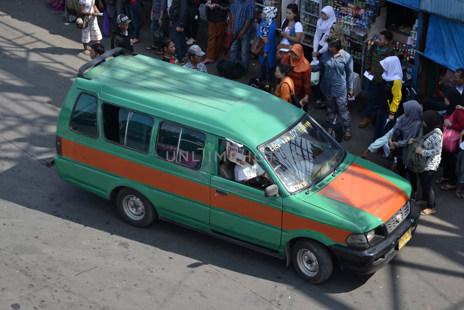 bandung, indonesia-june 16, 2014: public transportation in bandung city called angkot.