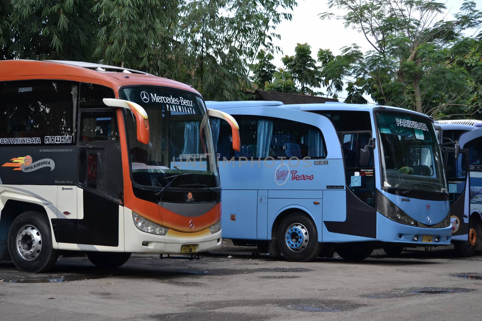 bandung, indonesia-june 16, 2014: bus parking at cicaheum bus station waiting for passenger to board.