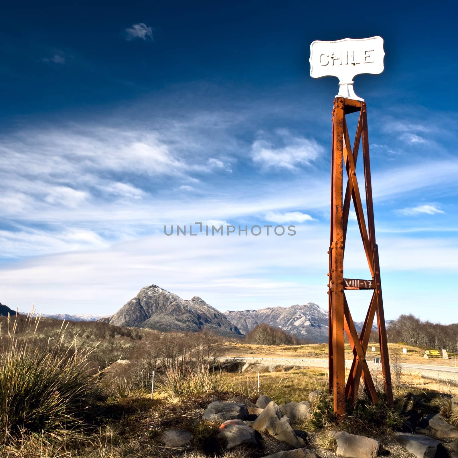 Vintage border post, Road sign at the Patagonia border of Argentina and Chile in Paso Cardenal Samore. Chile