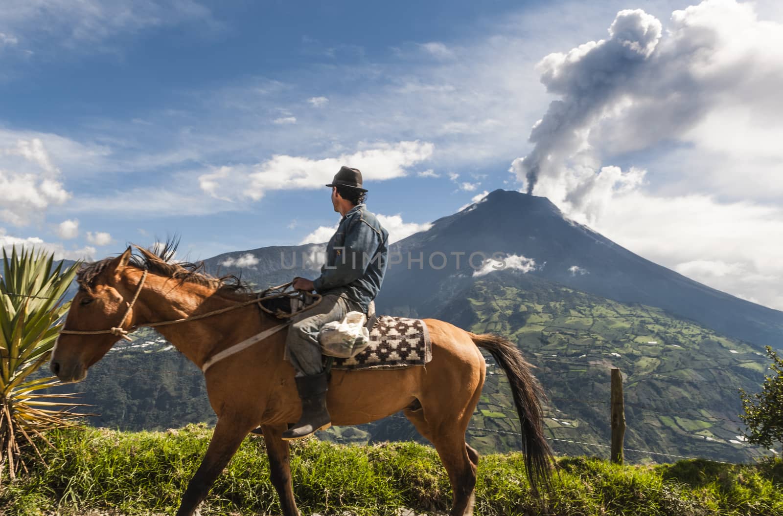 BANOS, ECUADOR - DECEMBER 10: Unrecognizable farmer on a horse l by xura