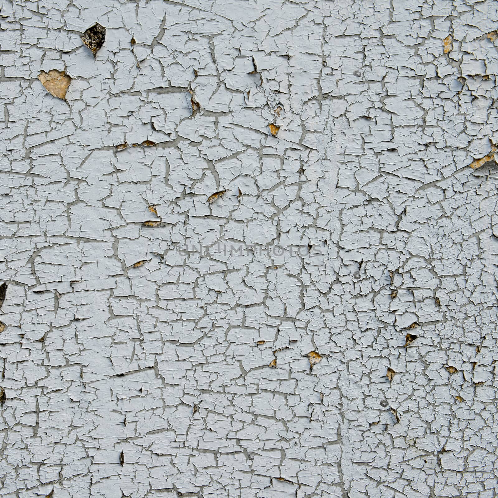 old cracked paint on the concrete wall 