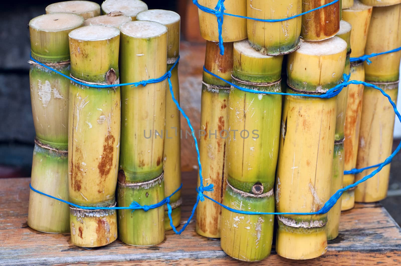 A close up photo of a stack of sugar cane sticks 