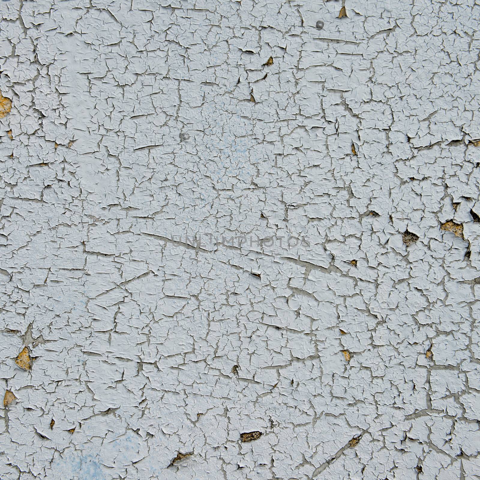 old cracked paint on the concrete wall 