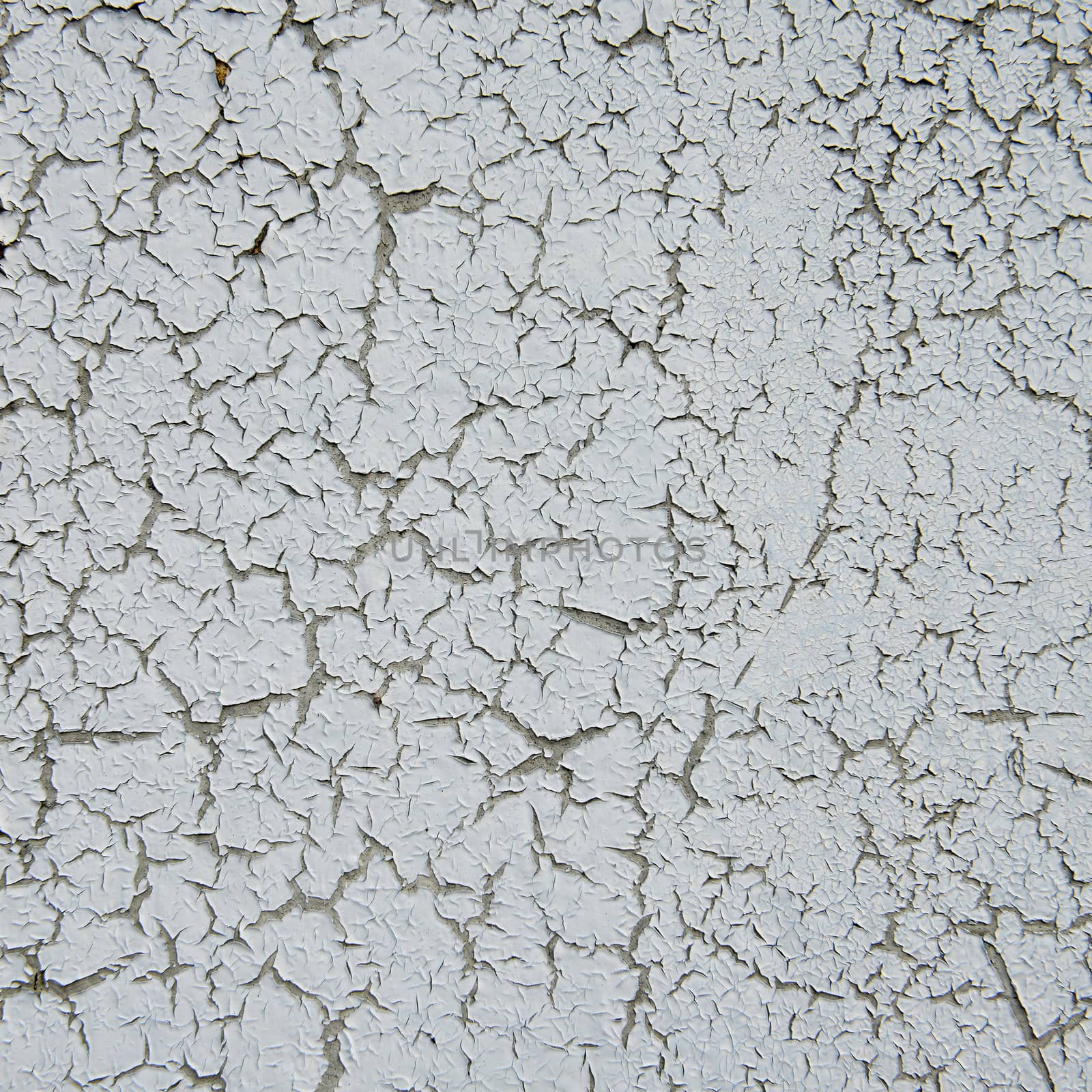 old cracked paint on the concrete wall 