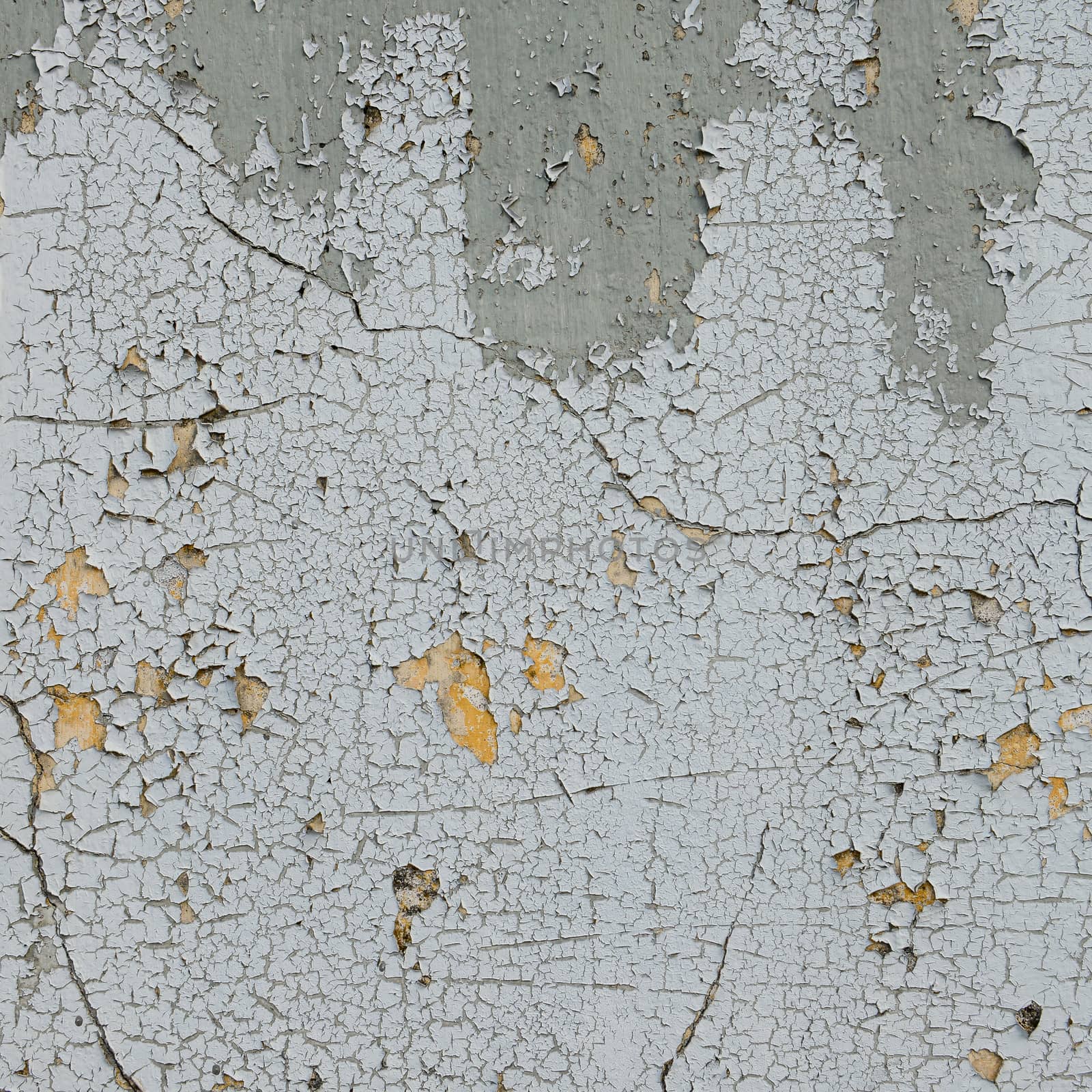 old cracked paint on the concrete wall 