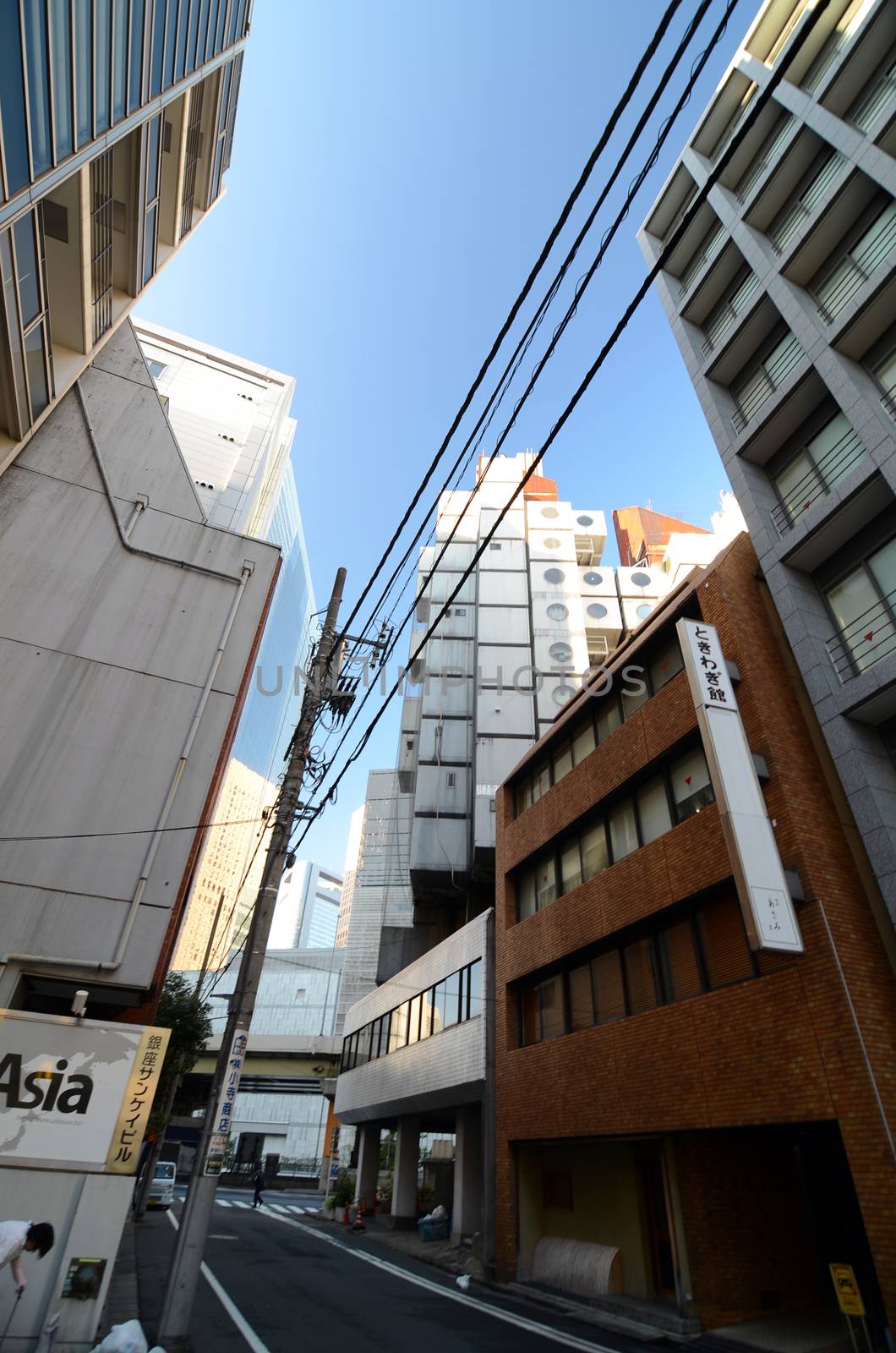 SHIMBASHI, JAPAN - NOV 26 : The Nakagin Capsule Tower in Tokyo by siraanamwong