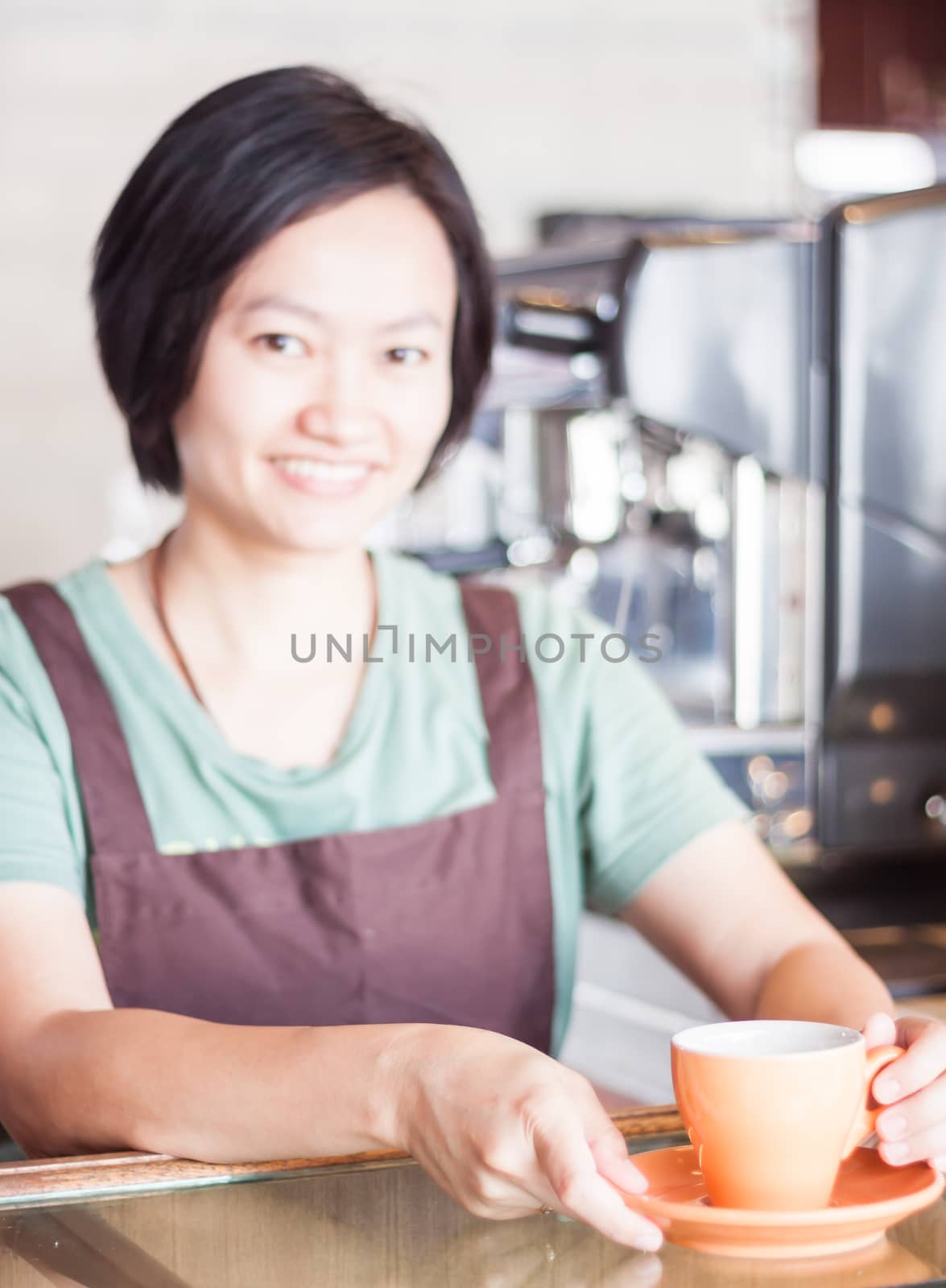 Barista prepares freshly brewed coffee, stock photo