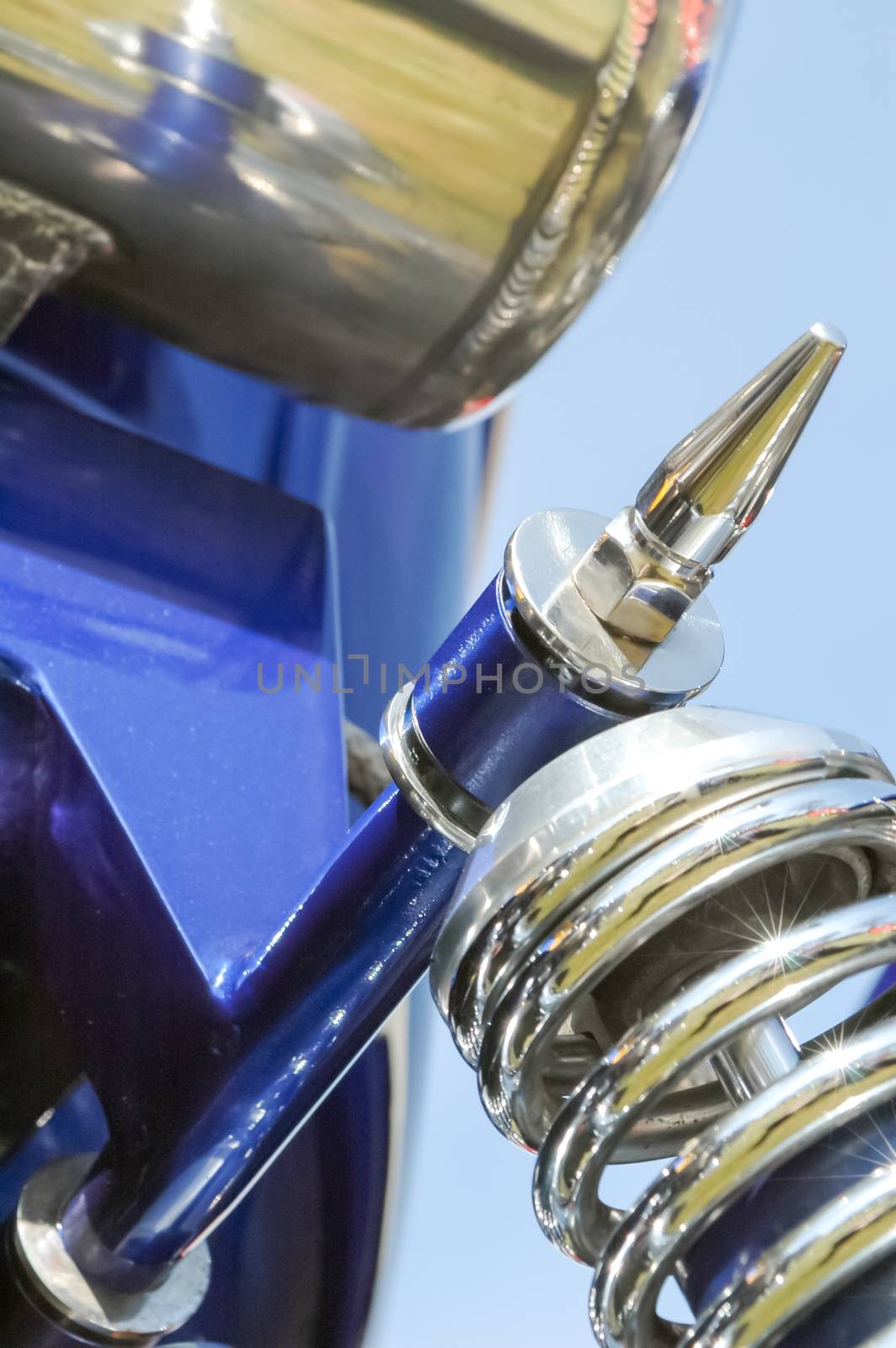 closeup of a chromed vehicle suspension spring