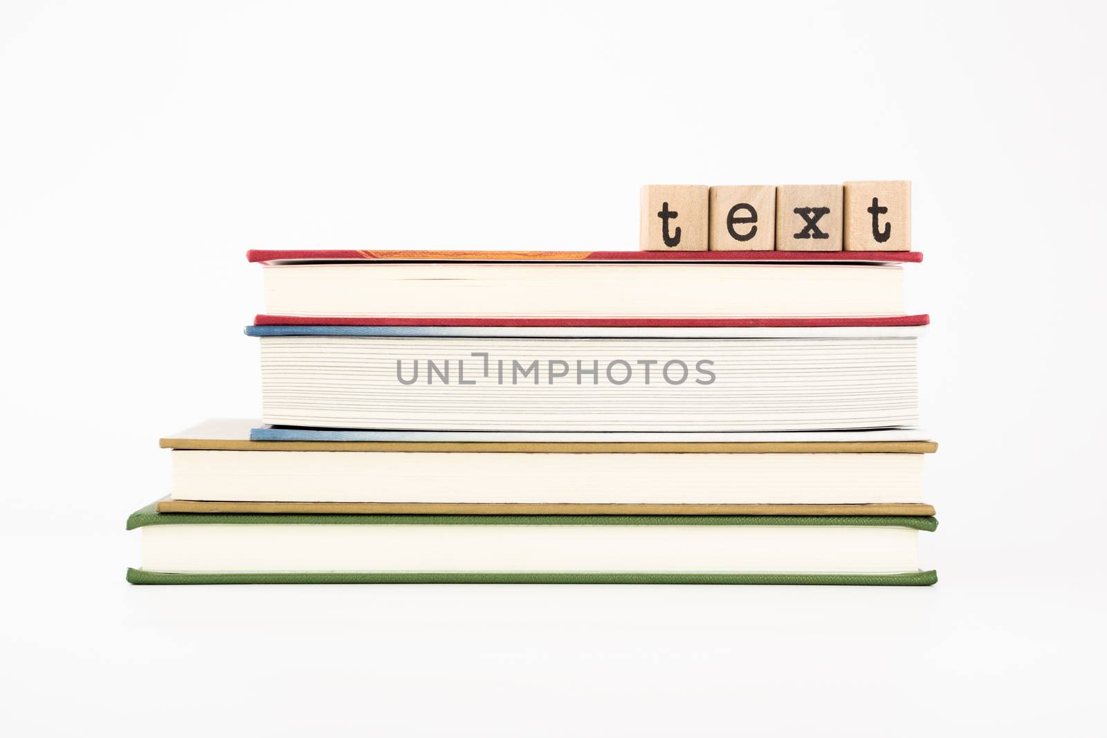 text word on wood stamps stack on books