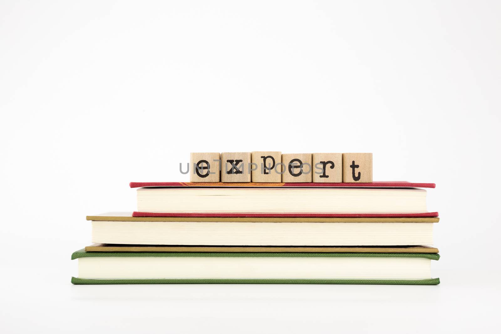 expert word on wood stamps stack on books