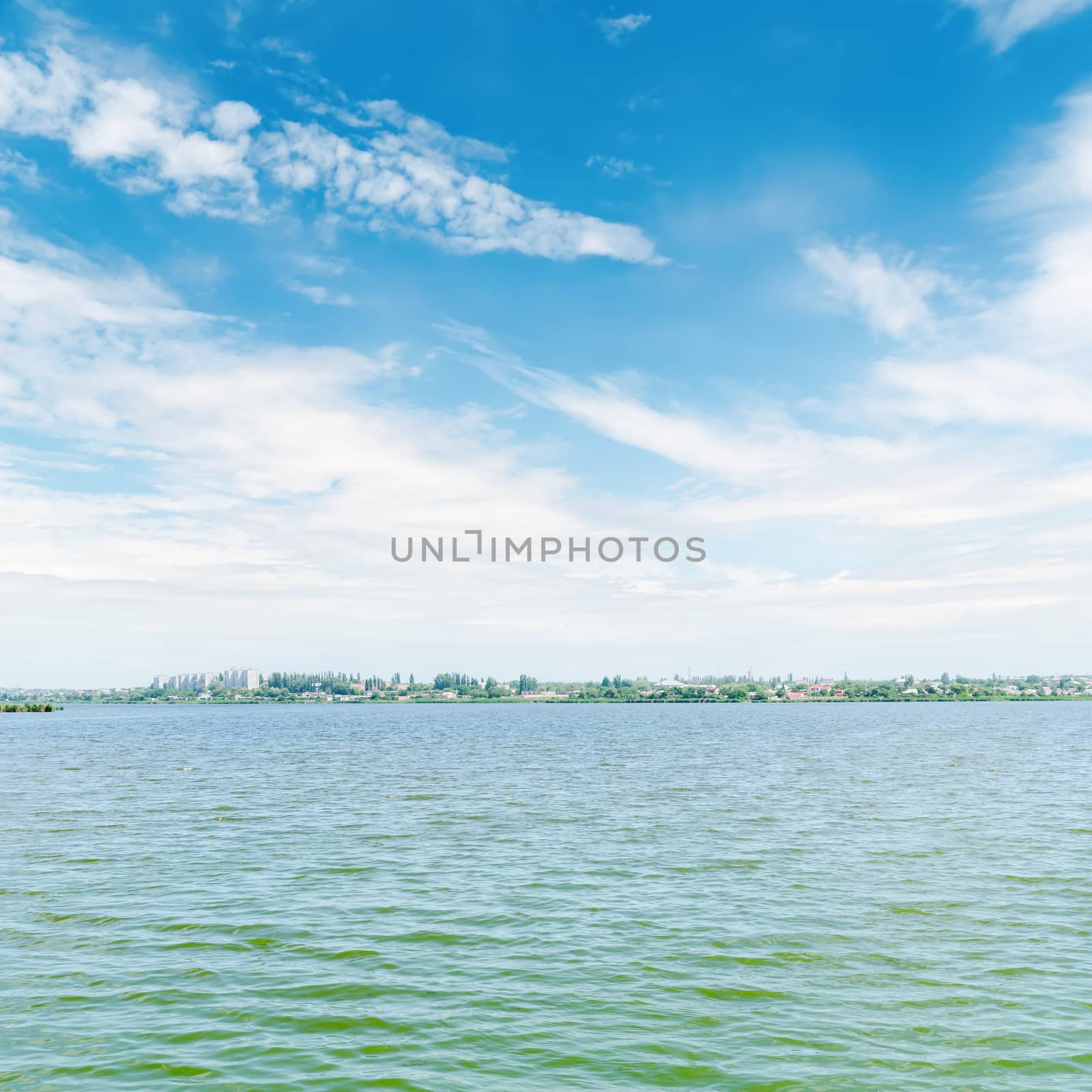 river and blue sky with white clouds