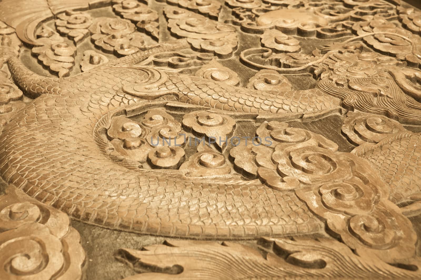 Close up of wood carving of a dragon
