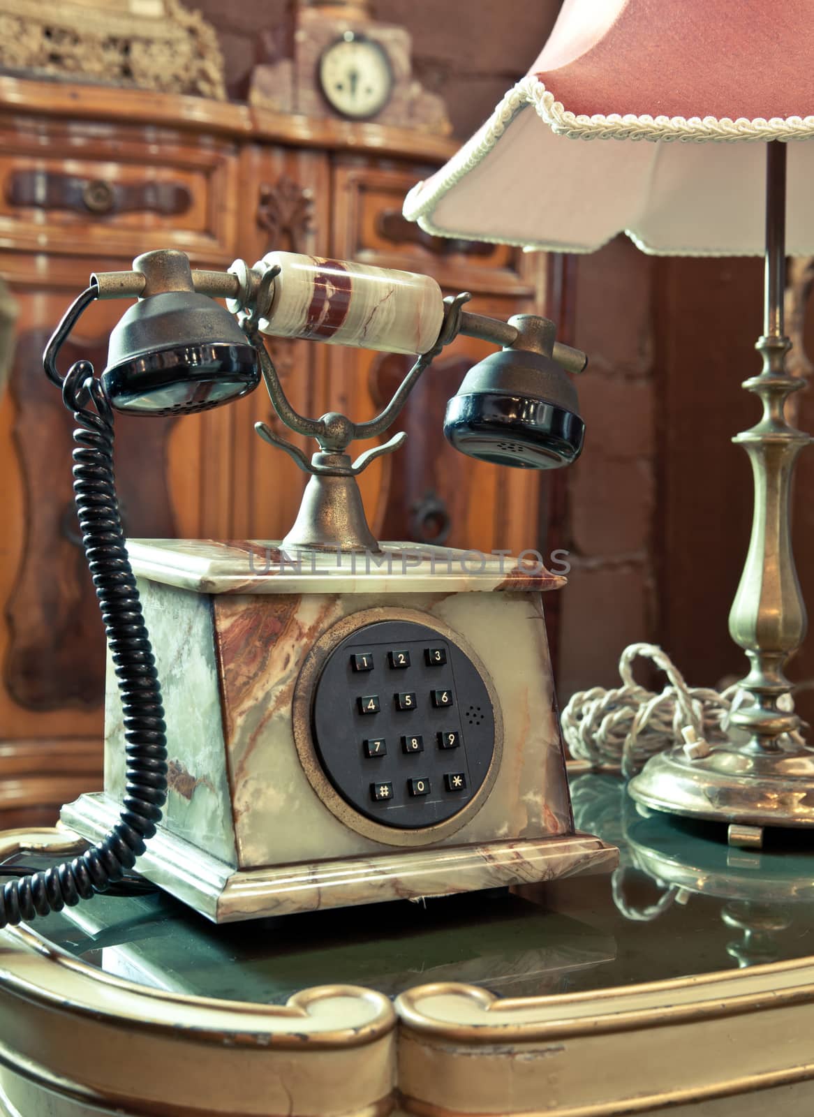 vintage telephone on the table by witthaya