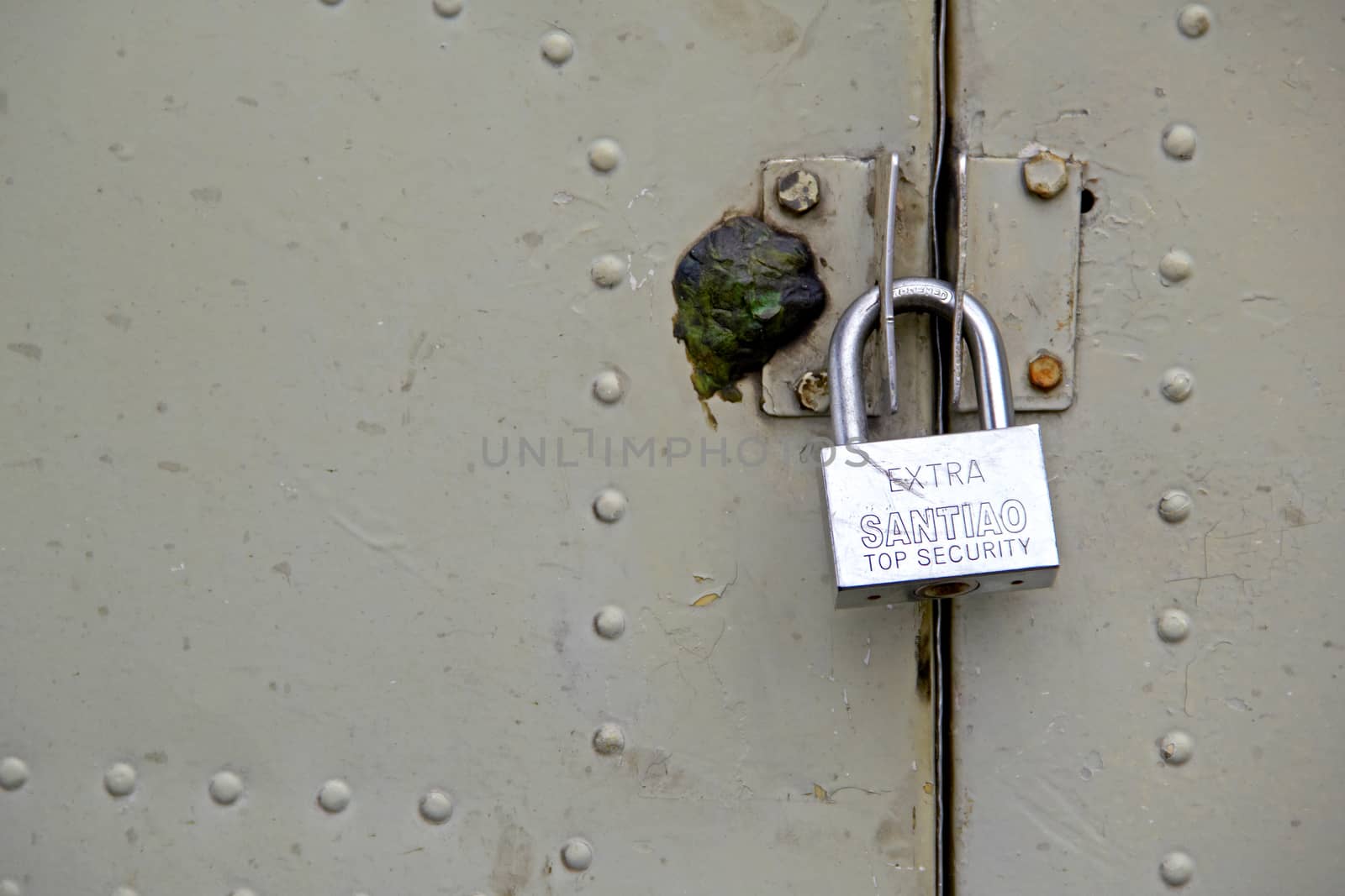 padlock the old metal door with seal