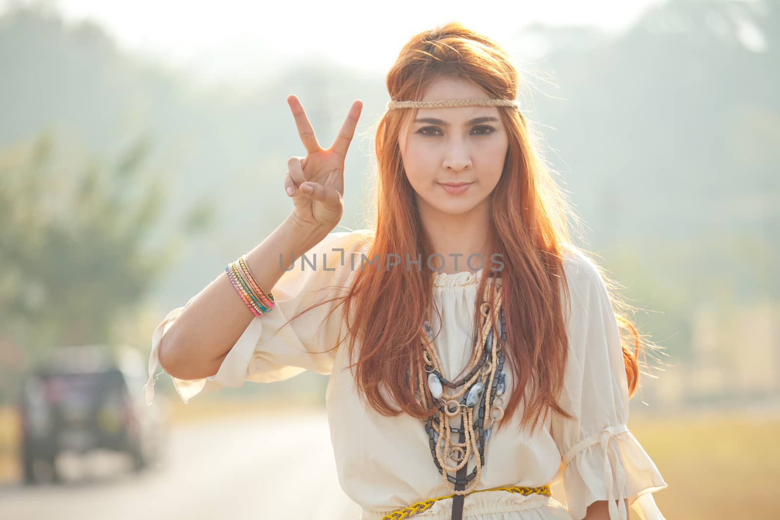 Hippie girl with peace signs by witthaya