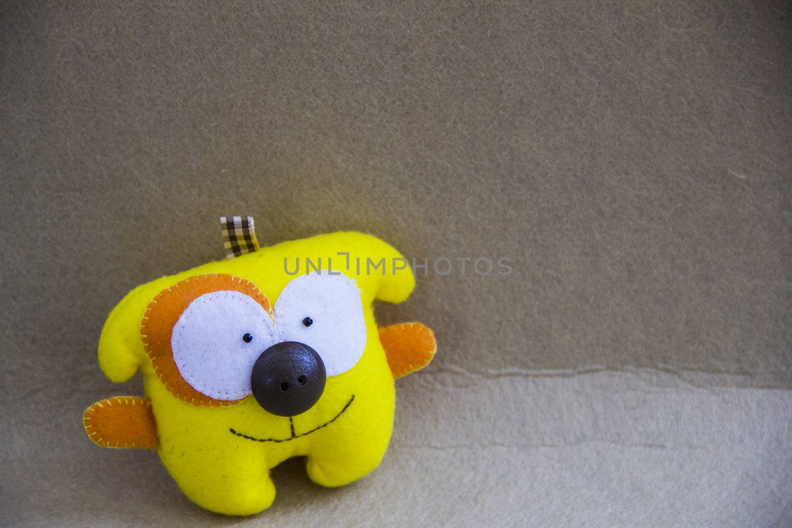 small small  beautiful smille  yellow textile dog